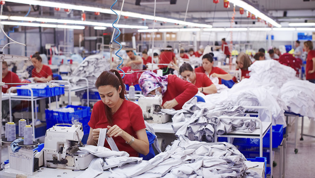 Workers in a Chinese factory representing modern forced labor in global supply chains