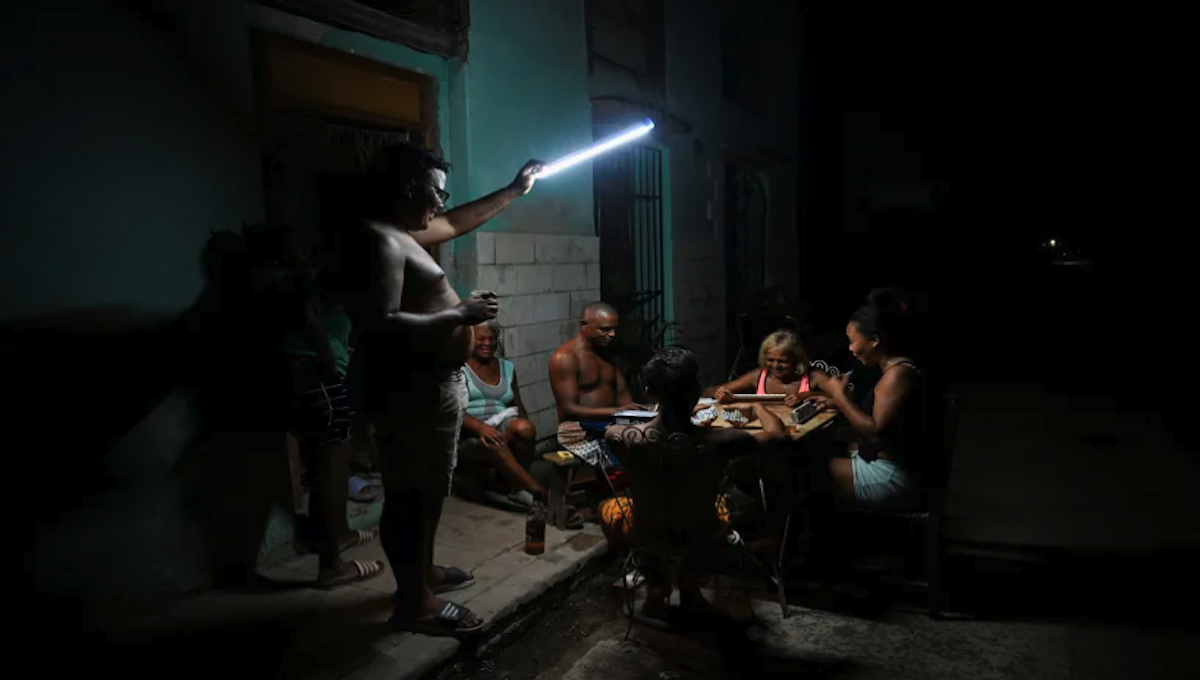 Cubans playing dominoes on the street during a power blackout in Havana 2026