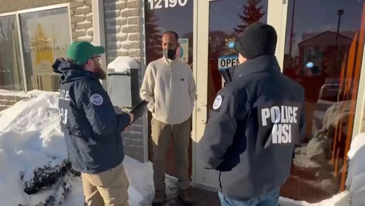 DHS agents interviewing a suspect in the Minnesota fraud investigation