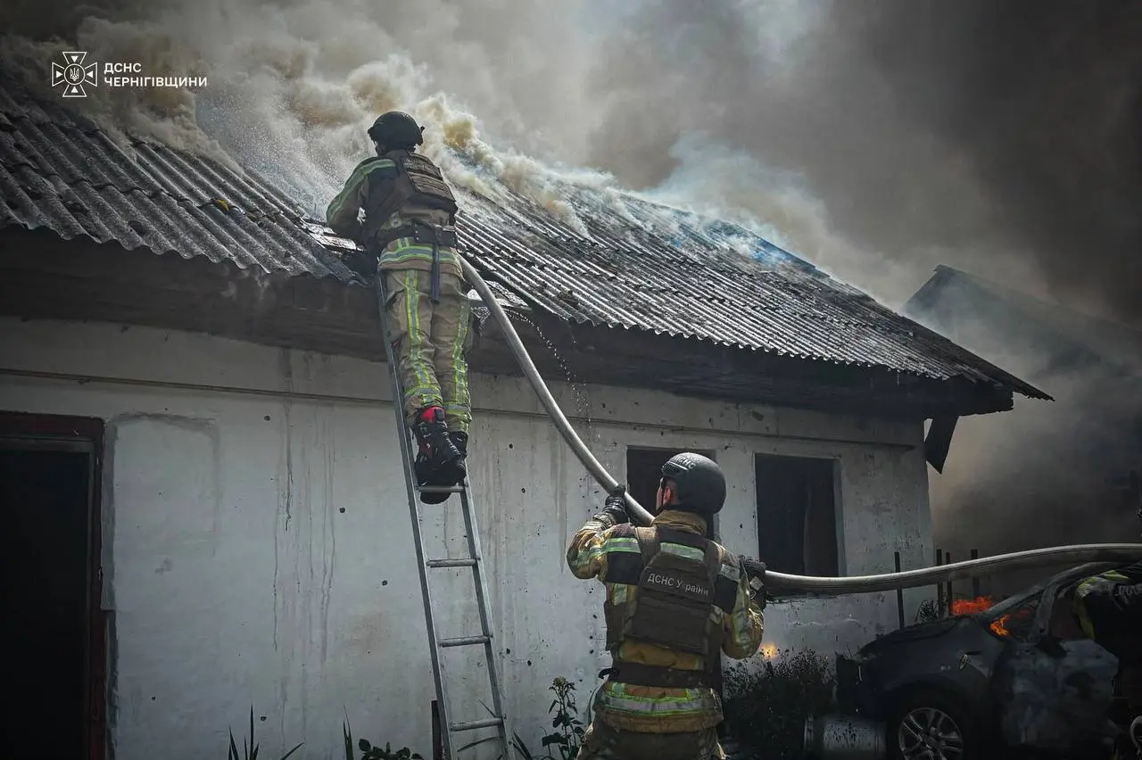 Aftermath of a Russian strike on a residential area in Ukraine, with a damaged apartment building and emergency responders at the scene, July 2026