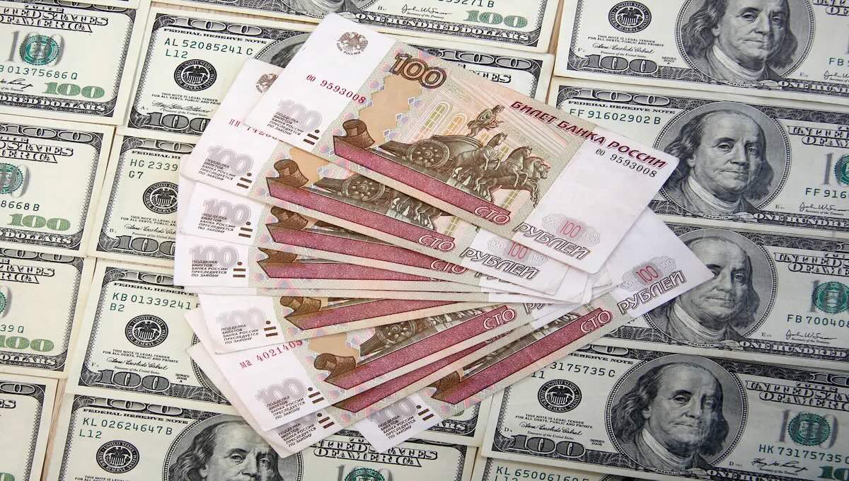 Russian and U.S. currency representing the financial interests profiting from the Russia-Ukraine war