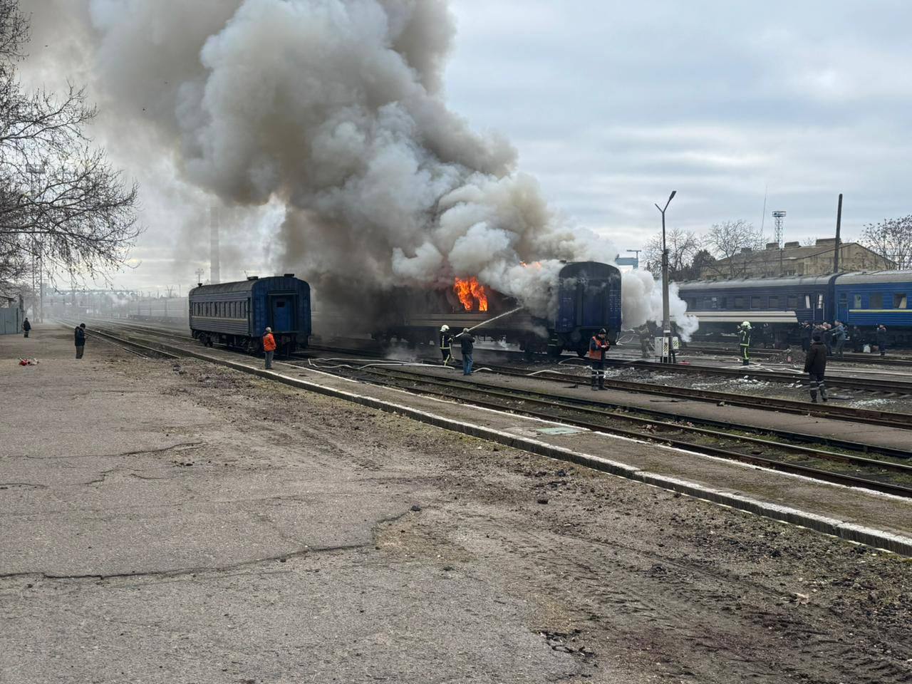 A Ukrainian passenger train on fire after being struck by a Russian Shahed drone in 2026