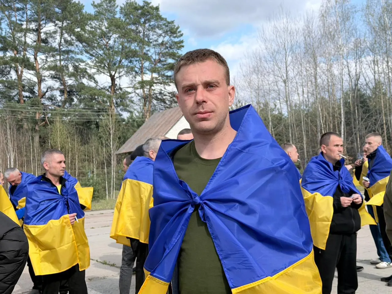 Ukrainian POWs being received at a transfer point after returning from Russian detention facilities in April 2026